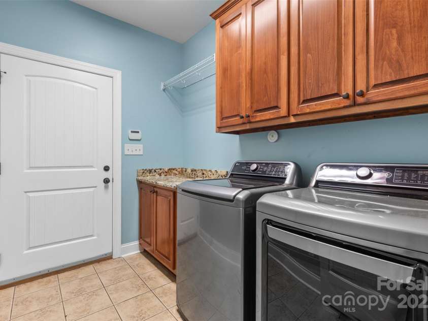 1313 Western Hills Lane, Vale, NC 28168.  MLS# CAR4272544, YatesRealty ID 9105. Spacious laundry room with built-in cabinets
