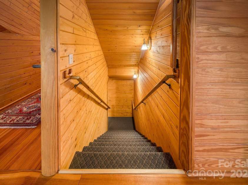 459 West Club Boulevard, Lake Toxaway, NC 28747.  MLS# CAR4220755, YatesRealty ID 911. Downstairs to finished basement