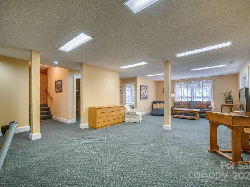 459 West Club Boulevard, Lake Toxaway, NC 28747.  MLS# CAR4220755, YatesRealty ID 911. Finished basement