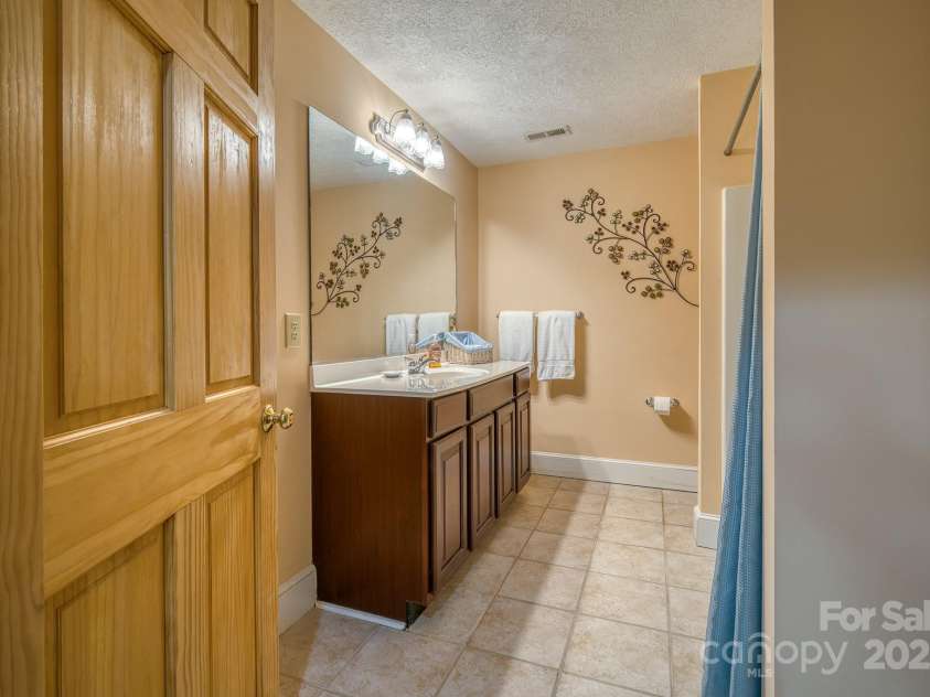 459 West Club Boulevard, Lake Toxaway, NC 28747.  MLS# CAR4220755, YatesRealty ID 911. Full bathroom basement level