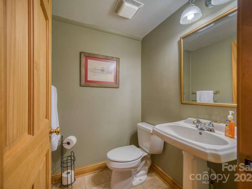 459 West Club Boulevard, Lake Toxaway, NC 28747.  MLS# CAR4220755, YatesRealty ID 911. Half bath off entry foyer
