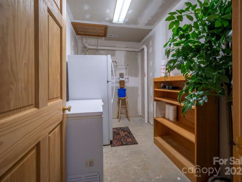 459 West Club Boulevard, Lake Toxaway, NC 28747.  MLS# CAR4220755, YatesRealty ID 911. More storage on basement level, water heater is located in this room