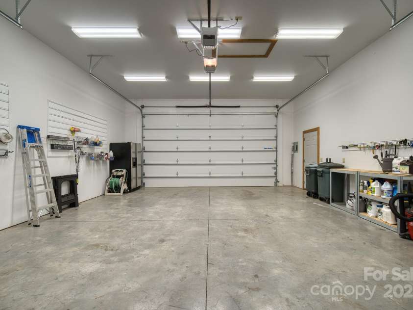 459 West Club Boulevard, Lake Toxaway, NC 28747.  MLS# CAR4220755, YatesRealty ID 911. Oversized two car garage / front door