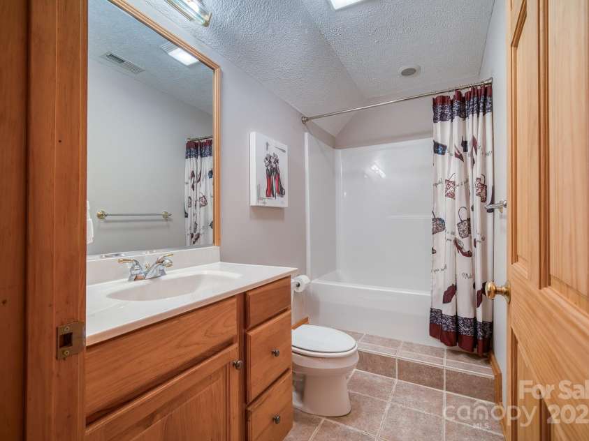 459 West Club Boulevard, Lake Toxaway, NC 28747.  MLS# CAR4220755, YatesRealty ID 911. Third bedroom private bath