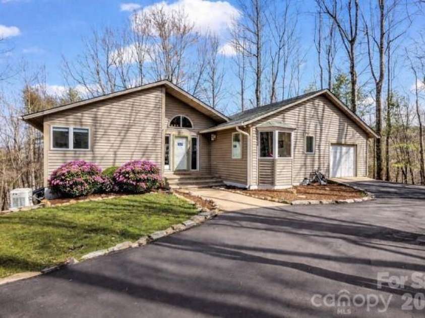 209 Walnut Ridge Road, Brevard, NC 28712.  MLS# CAR4361417, YatesRealty ID 9116. Landscape virtually added to left of front door