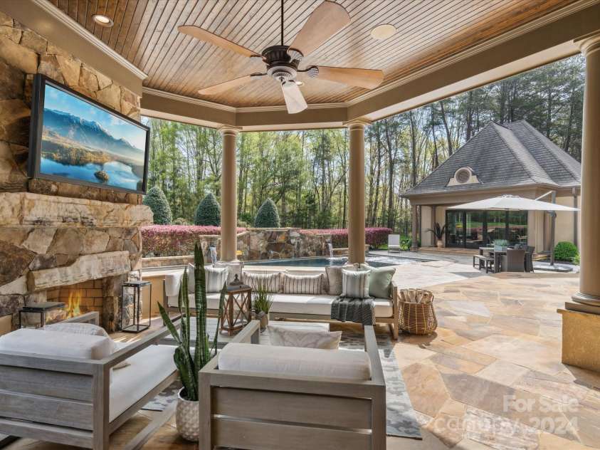 9044 Island Point Road, Charlotte, NC 28278.  MLS# CAR4135509, YatesRealty ID 912. Outdoor Grill & fireplace area overlooking the pool area