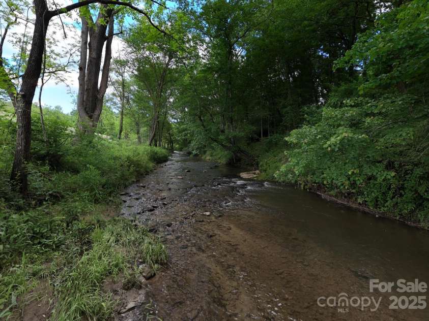 325 Avery Trail Drive, Arden, NC 28704.  MLS# CAR4252544, YatesRealty ID 9121. Creek