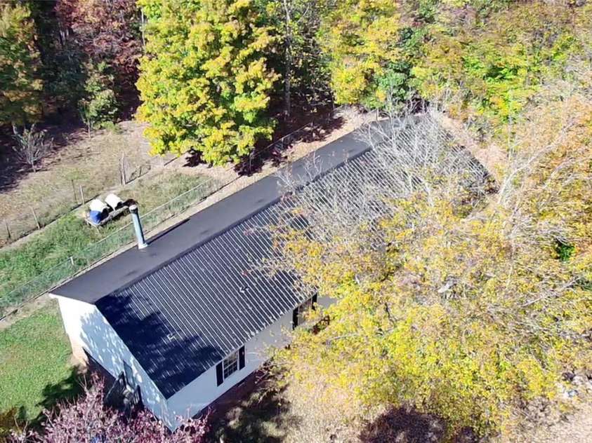 276 Ostwalt Amity Road, Troutman, NC 28166.  MLS# CAR4083302, YatesRealty ID 9126. Areal view, metal roof