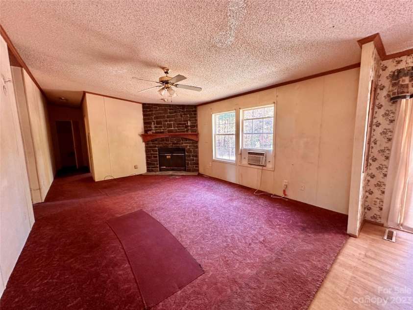 276 Ostwalt Amity Road, Troutman, NC 28166.  MLS# CAR4083302, YatesRealty ID 9126. Family room