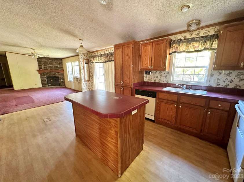 276 Ostwalt Amity Road, Troutman, NC 28166.  MLS# CAR4083302, YatesRealty ID 9126. Kitchen with island