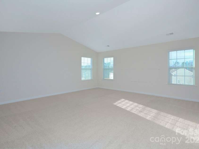 427 Carolina Hemlock Drive, Locust, NC 28097.  MLS# CAR4265067, YatesRealty ID 9127. Huge Primary Bedroom with vaulted ceilings
