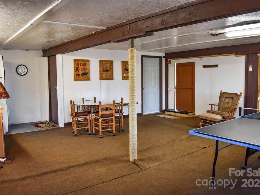 77 Nash Trail, Bryson City, NC 28713.  MLS# CAR4220215, YatesRealty ID 913. Lower level has cement floor