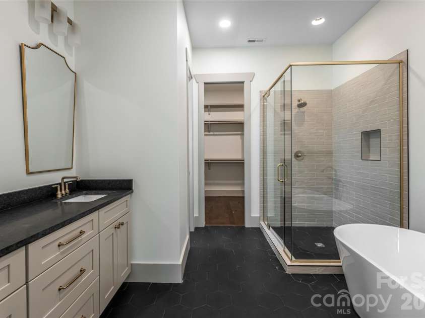 110 Unadilla Avenue, Asheville, NC 28803.  MLS# CAR4249602, YatesRealty ID 9132. Primary suite bathroom