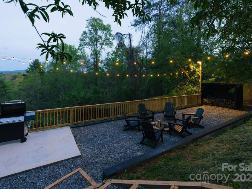 375 Sheppard Branch Road, Weaverville, NC 28787.  MLS# CAR4228322, YatesRealty ID 9134. Enjoy your fire pit, grill area, and even a covered shed for firewood
