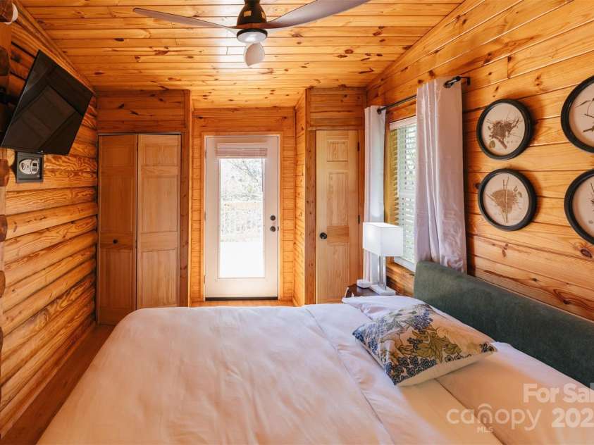 375 Sheppard Branch Road, Weaverville, NC 28787.  MLS# CAR4228322, YatesRealty ID 9134. Primary bedroom with mountain views & door out to deck