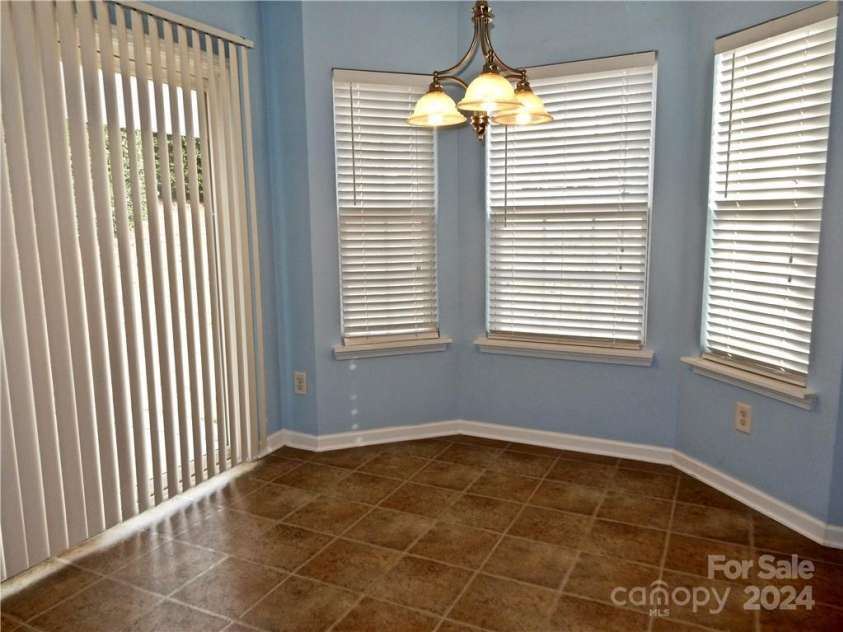 7374 Sun Dance Drive, Fort Mill, SC 29707.  MLS# CAR4201901, YatesRealty ID 914. Dining Area w/Bay Window...sliding glass door accessing patio
