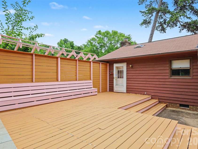 2114 Wilson Avenue, Charlotte, NC 28208.  MLS# CAR4391484, YatesRealty ID 9153. Back deck with seating area and privacy wall