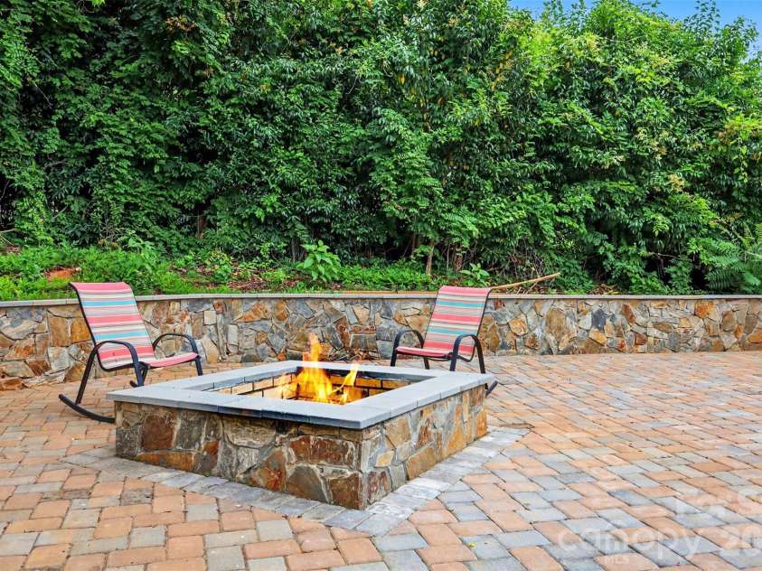 2114 Wilson Avenue, Charlotte, NC 28208.  MLS# CAR4391484, YatesRealty ID 9153. Custom stone patio with built in fire pit.