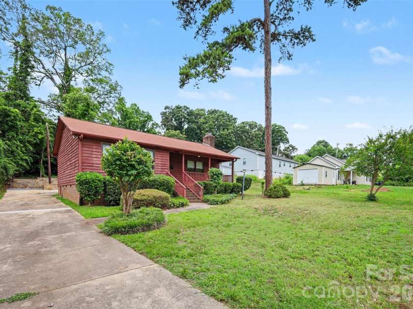 2114 Wilson Avenue, Charlotte, NC 28208.  MLS# CAR4391484, YatesRealty ID 9153. Exterior showing driveway parking and front yard space.