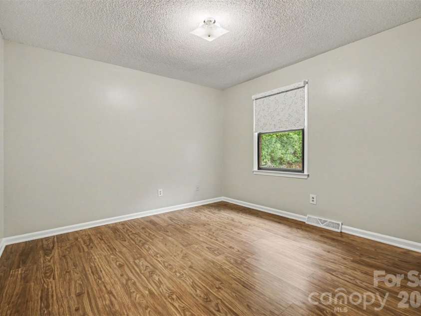 2114 Wilson Avenue, Charlotte, NC 28208.  MLS# CAR4391484, YatesRealty ID 9153. Large second bedroom with luxury vinyl plank flooring.