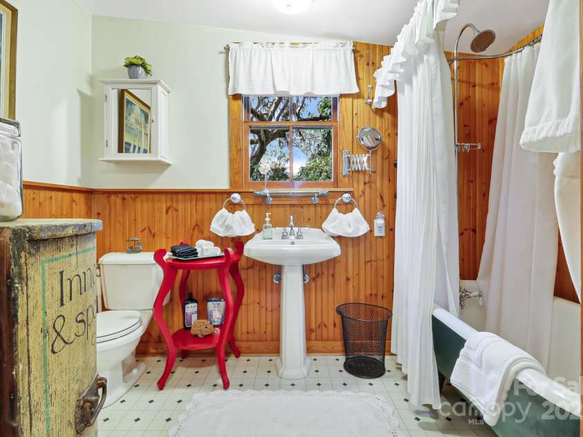 131 Pritchard Street, Bluffton, SC 29910.  MLS# CAR4214365, YatesRealty ID 916. Bathroom with clawfoot tub/shower & pedestal sink
