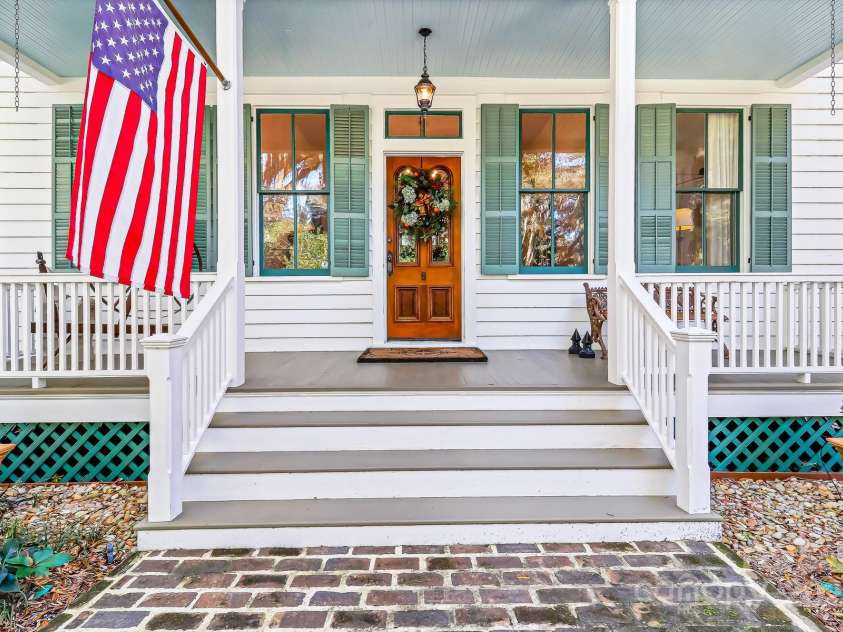 131 Pritchard Street, Bluffton, SC 29910.  MLS# CAR4214365, YatesRealty ID 916. Guest Entrance, large rocking chair porch