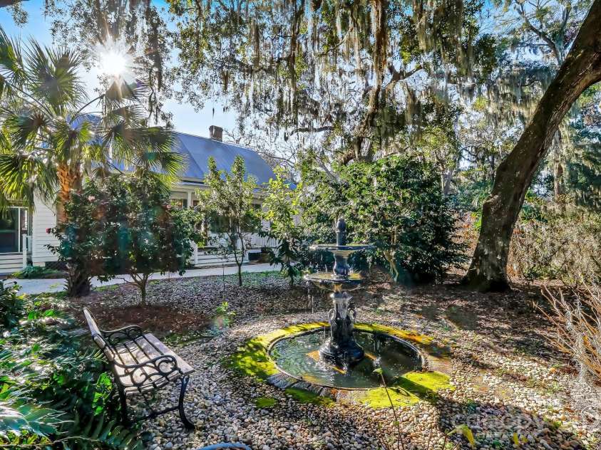 131 Pritchard Street, Bluffton, SC 29910.  MLS# CAR4214365, YatesRealty ID 916. Reflect on the bench under the Live Oaks while enjoying the fountain