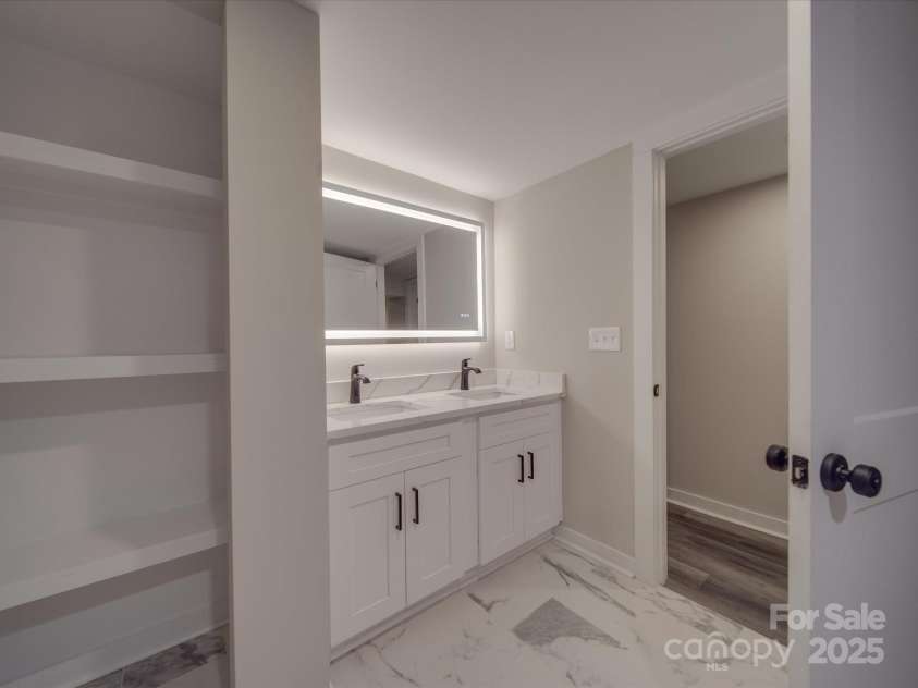 908 Davenport Street, Charlotte, NC 28208.  MLS# CAR4223250, YatesRealty ID 916. Downstairs bathroom