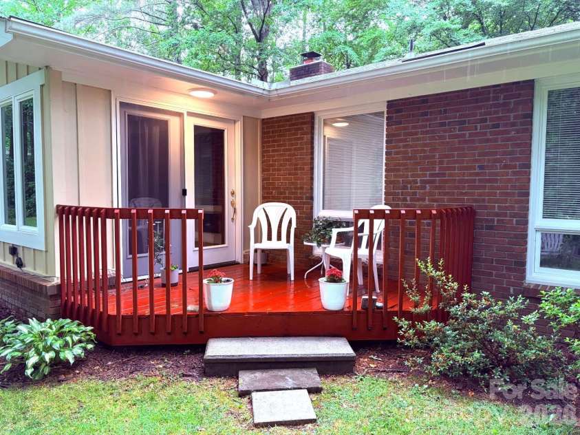 106 Laurel Lane, Etowah, NC 28729.  MLS# CAR4354319, YatesRealty ID 9161. Back deck off of the sunroom
