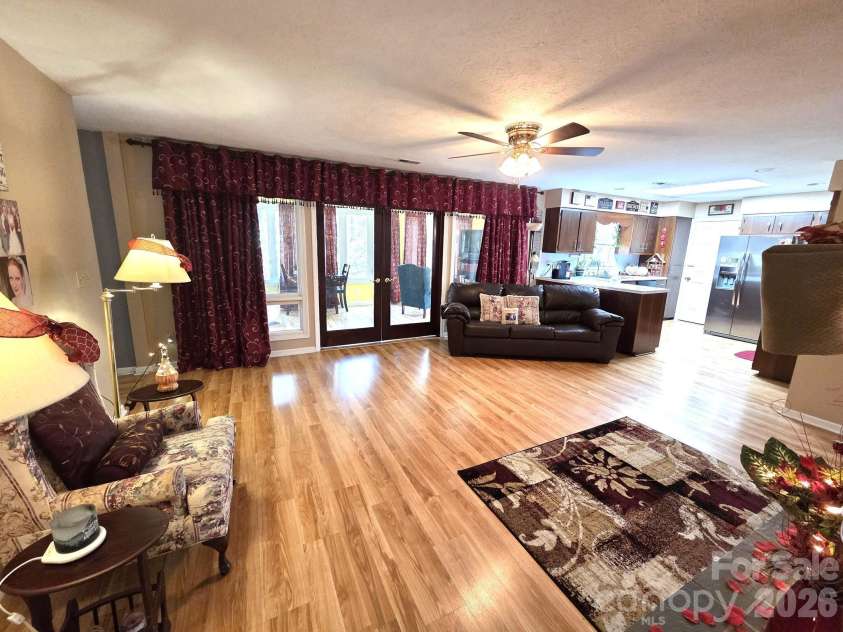 106 Laurel Lane, Etowah, NC 28729.  MLS# CAR4354319, YatesRealty ID 9161. Living room opens to kitchen and sunroom