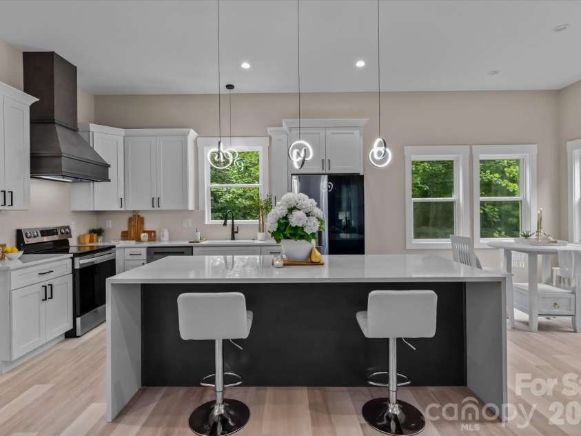 4435 Cornett Drive, Iron Station, NC 28080.  MLS# CAR4293184, YatesRealty ID 9172. Kitchen w/waterfall quartz accent island