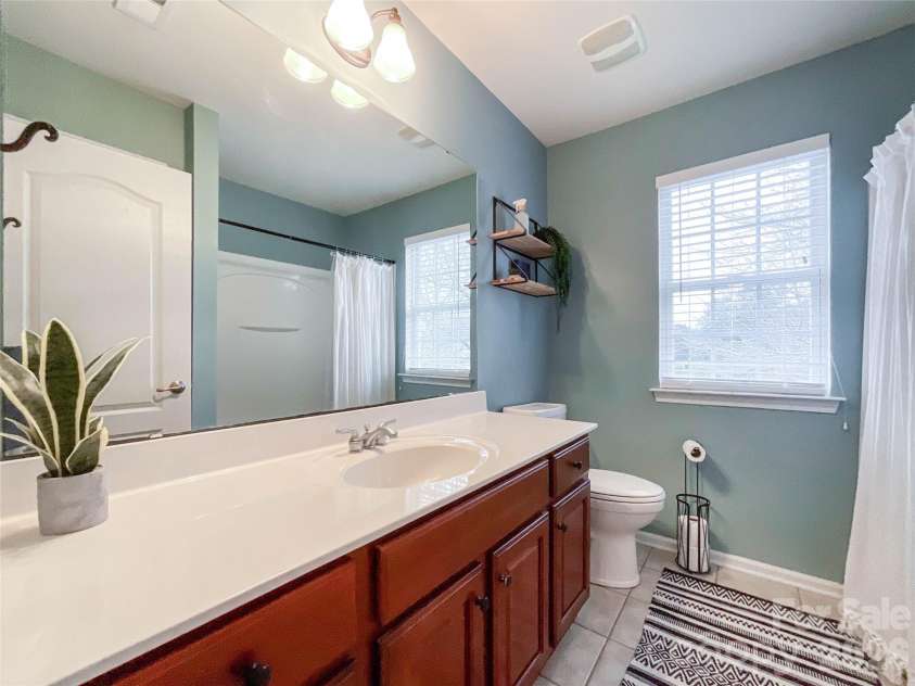 2005 Blue Iris Drive, Matthews, NC 28104.  MLS# CAR4350596, YatesRealty ID 9174. Full bathroom upstairs 