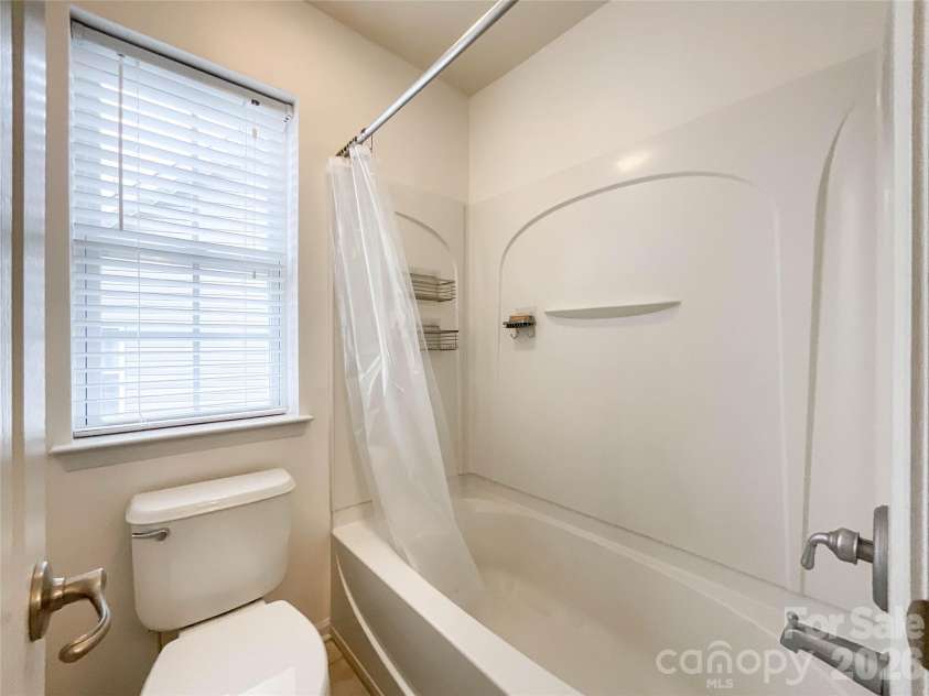 2005 Blue Iris Drive, Matthews, NC 28104.  MLS# CAR4350596, YatesRealty ID 9174. Jack and Jill bathroom 