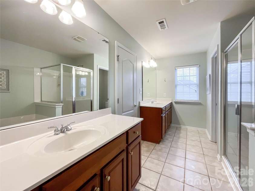2005 Blue Iris Drive, Matthews, NC 28104.  MLS# CAR4350596, YatesRealty ID 9174. Primary bathroom 
