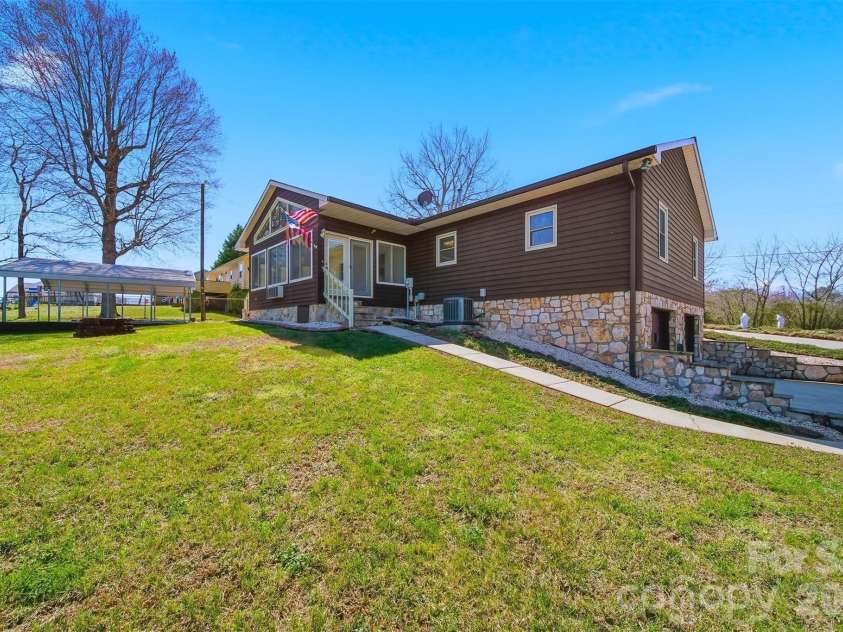 4716 Bert Huffman Drive, Granite Falls, NC 28630.  MLS# CAR4356442, YatesRealty ID 9177. Half acre partially fenced in backyard! 