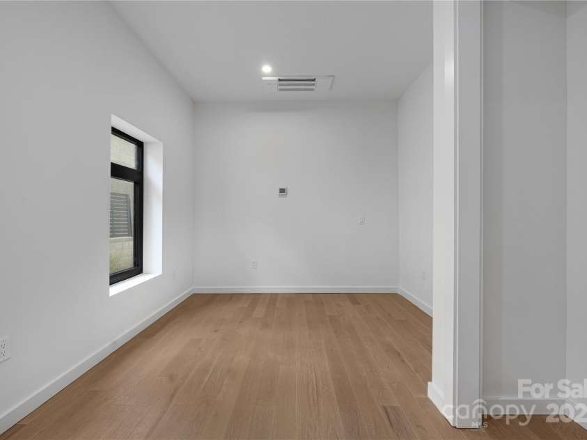 2804 Shenandoah Avenue, Charlotte, NC 28205.  MLS# CAR4321952, YatesRealty ID 918. Lower-level guest apartment bedroom.