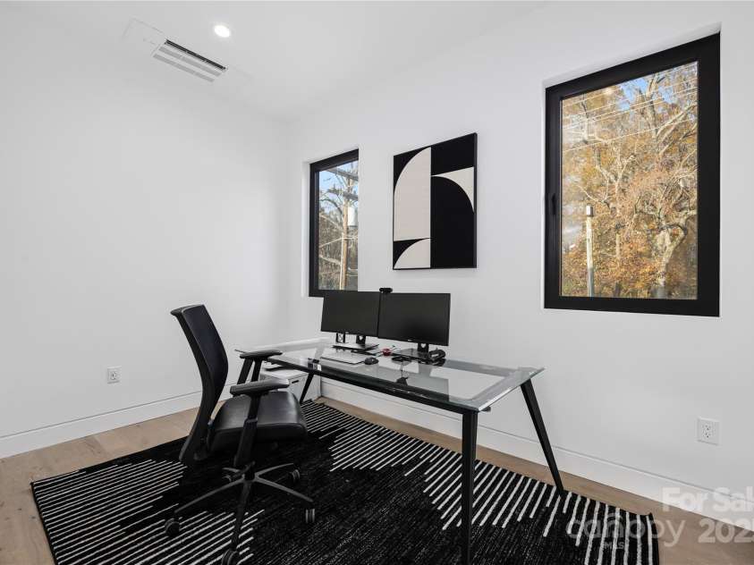 2804 Shenandoah Avenue, Charlotte, NC 28205.  MLS# CAR4321952, YatesRealty ID 918. Main-level guest bedroom with ensuite bathroom, currently utilized as a home office. 