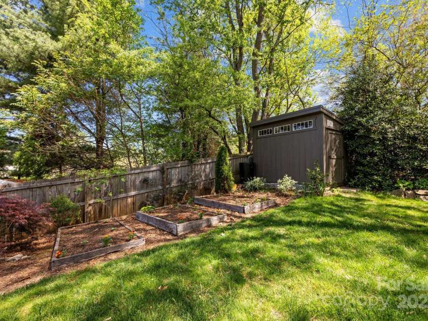 164 Deaver Street, Asheville, NC 28806.  MLS# CAR4249917, YatesRealty ID 9181. Raised beds and a new storage shed