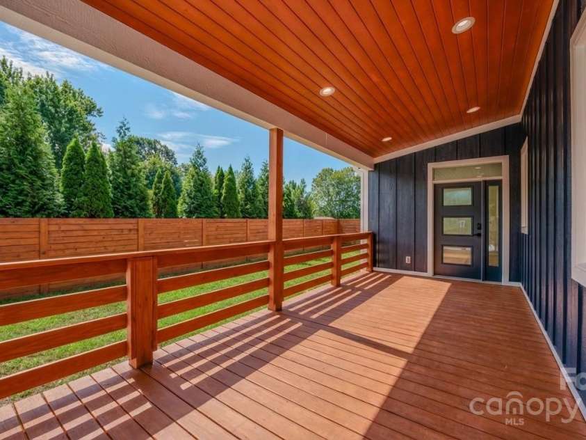 133 Grove Street, Asheville, NC 28801.  MLS# CAR4286313, YatesRealty ID 919. Front deck Photo enhanced to give the buyer inspiration for privacy fencing