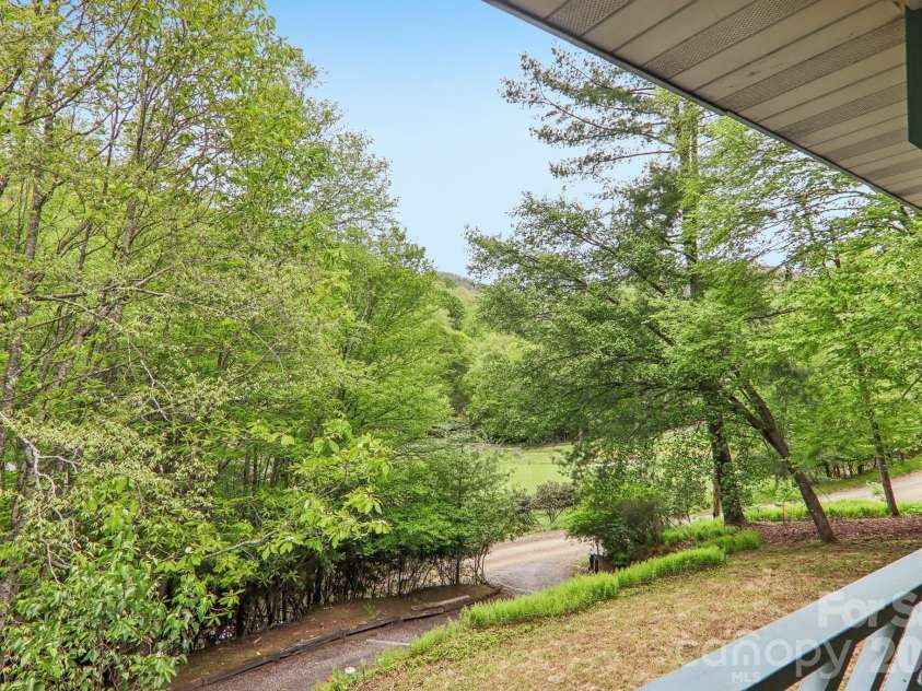 210 Spring Valley Drive, Mars Hill, NC 28754.  MLS# CAR4337752, YatesRealty ID 9192. Double covered decks for outdoor living.