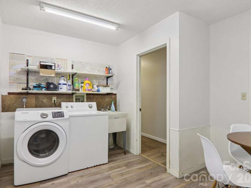 210 Spring Valley Drive, Mars Hill, NC 28754.  MLS# CAR4337752, YatesRealty ID 9192. Lower level laundry room.