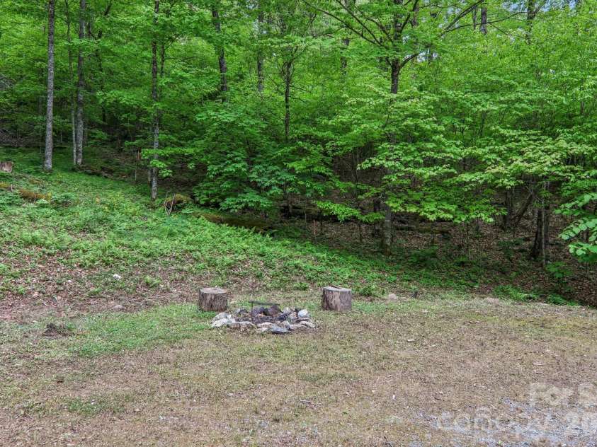 210 Spring Valley Drive, Mars Hill, NC 28754.  MLS# CAR4337752, YatesRealty ID 9192. Outdoor fire pit