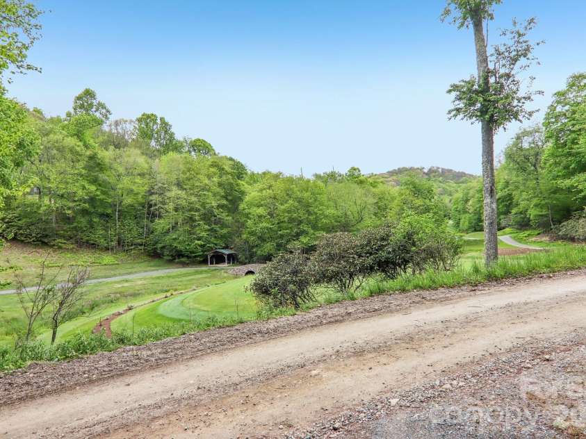 210 Spring Valley Drive, Mars Hill, NC 28754.  MLS# CAR4337752, YatesRealty ID 9192. Views of the golf course from you front porch.
