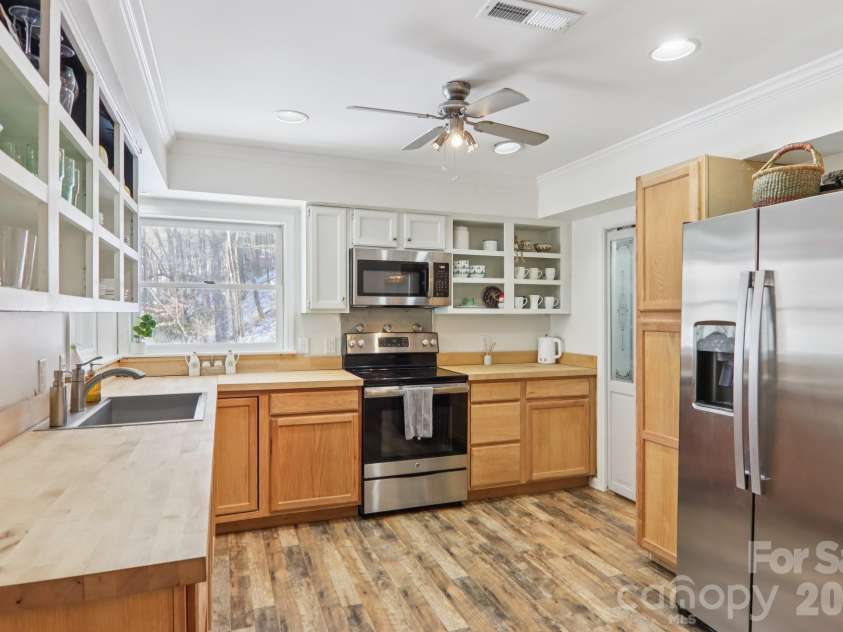 210 Spring Valley Drive, Mars Hill, NC 28754.  MLS# CAR4337752, YatesRealty ID 9192. Walk in pantry, ample cabinetry and butcher block countertops.
