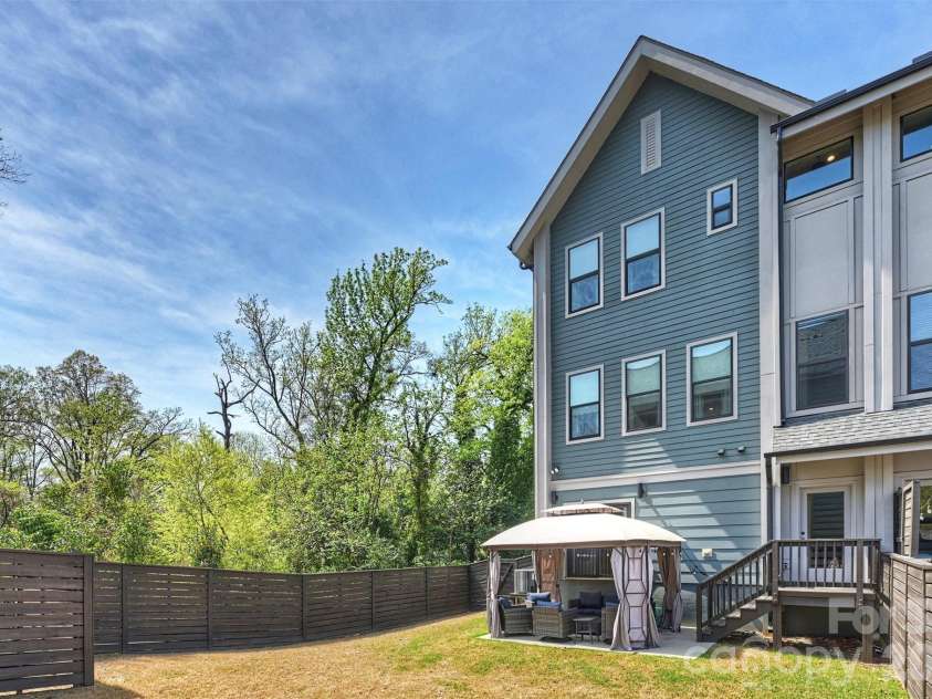 1500 Hawthorne Lane, Charlotte, NC 28205.  MLS# CAR4364740, YatesRealty ID 9199. Privacy, greenery, and back yard space!
