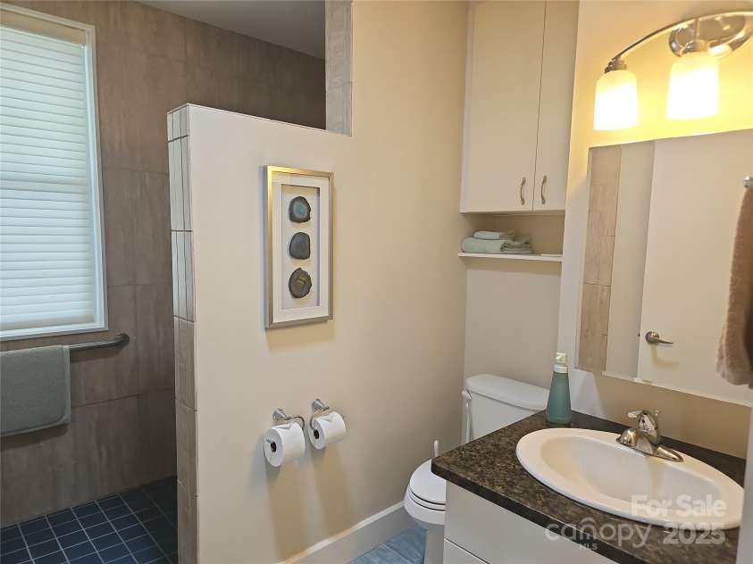 2905 Medlin Road, Monroe, NC 28112.  MLS# CAR4267802, YatesRealty ID 920. Bathroom with walk in shower for two bedrooms