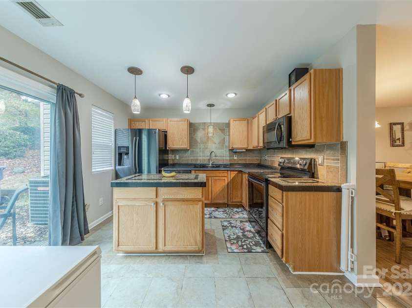 1581 Maypine Commons Way, Rock Hill, SC 29732.  MLS# CAR4307563, YatesRealty ID 922. Kitchen with access to rear patio