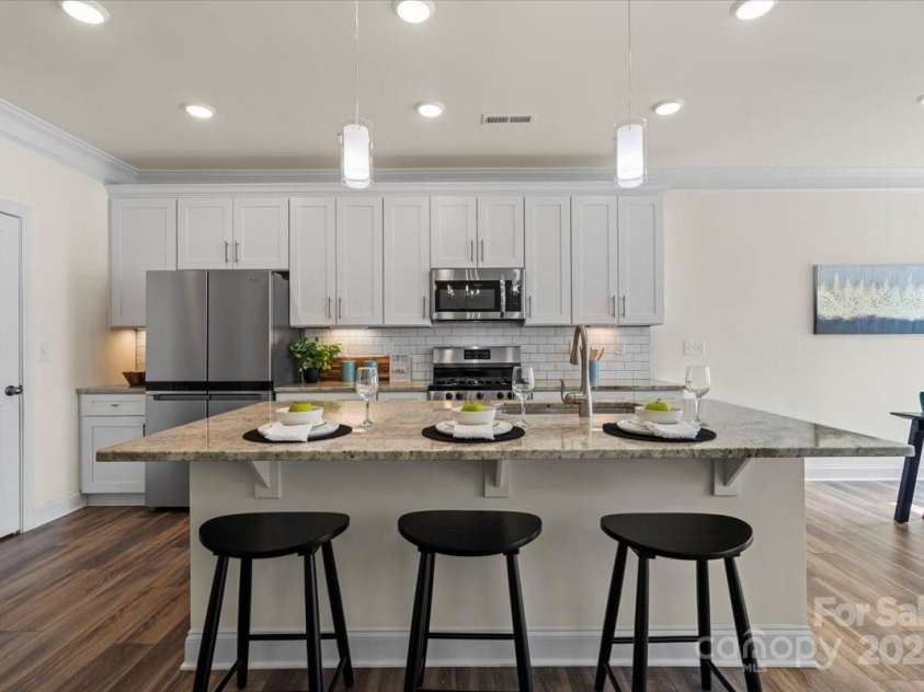 6450 Keeton Lane, Harrisburg, NC 28075.  MLS# CAR4232807, YatesRealty ID 9241. Large island with new pendant lights