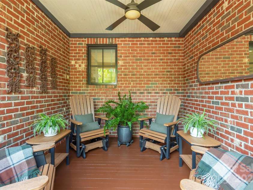 13 Fitzgerald Road, Black Mountain, NC 28711.  MLS# CAR4176177, YatesRealty ID 9244. Covered front porch sitting area.