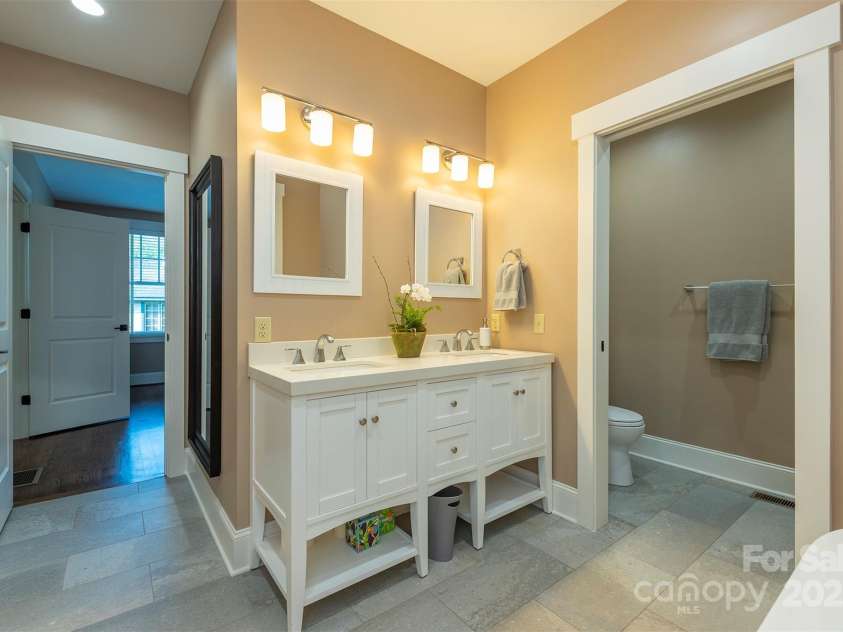 13 Fitzgerald Road, Black Mountain, NC 28711.  MLS# CAR4176177, YatesRealty ID 9244. Full bathroom on main with soaking tub and shower.